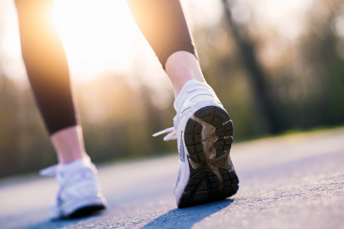 Female Runner feet sunrise walking outside